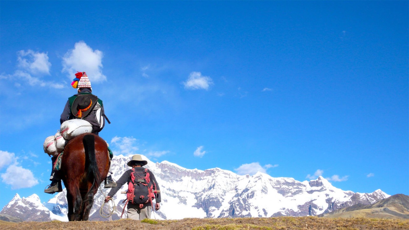 Rider and Backpacker in the Andes