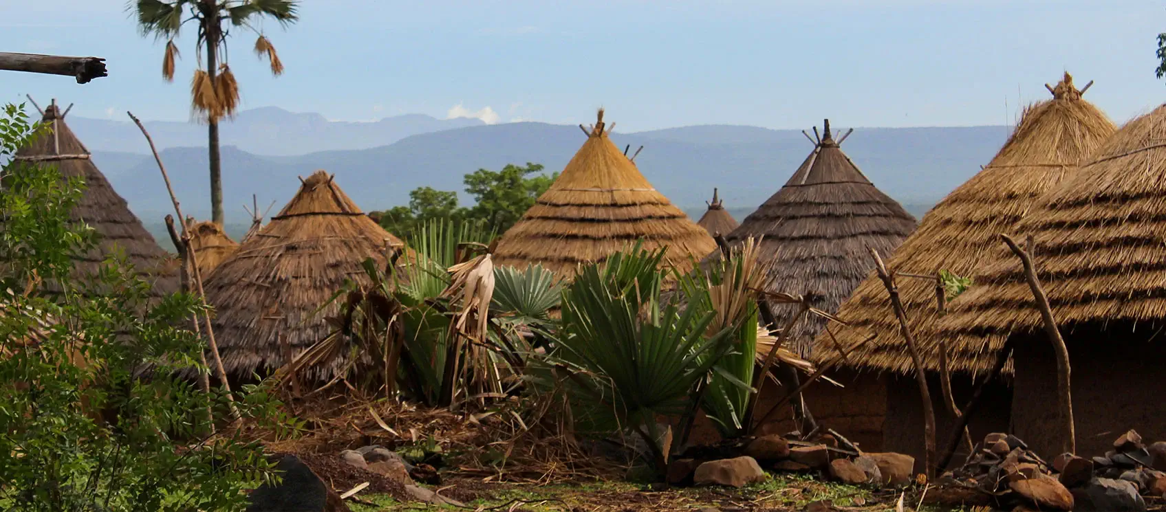 Senegal Abodes With Mountains In Background