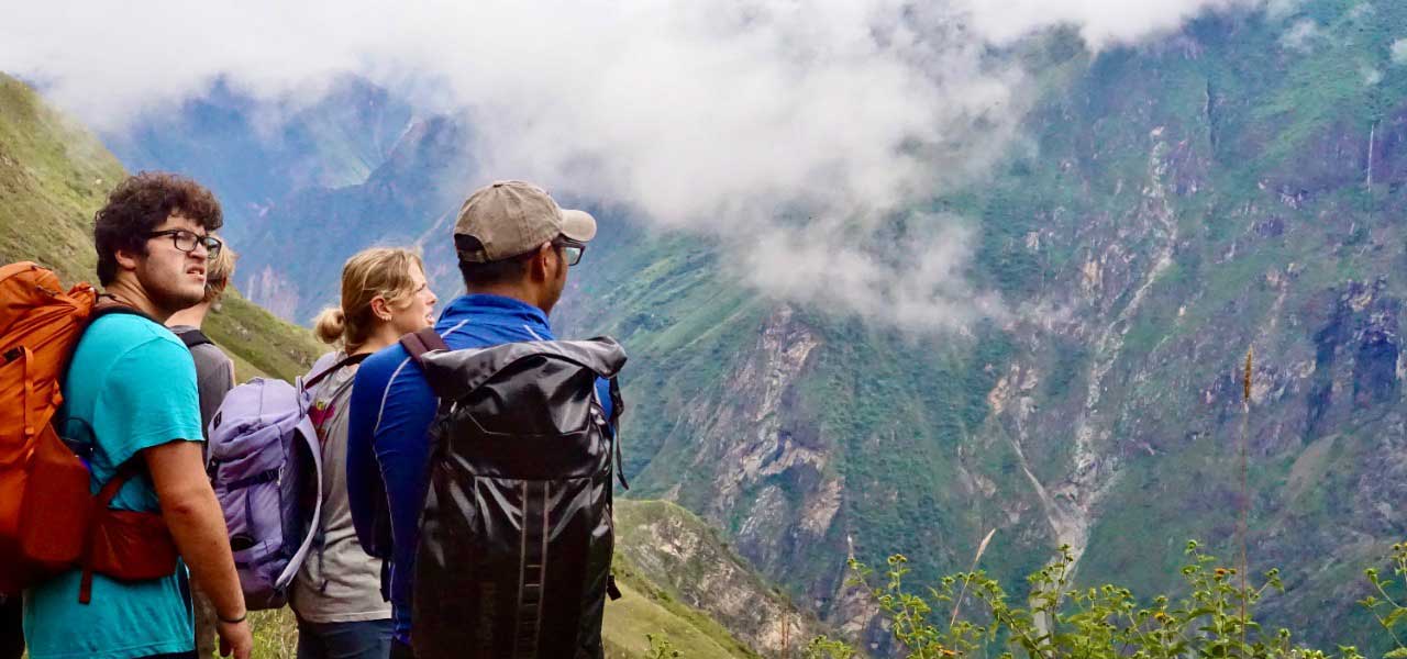 group of gap year program students on a hike in Peru looking out on the mountains